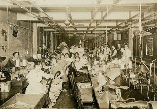 Seamstresses at their stations in the Consolidated Garment Company sewing workshop